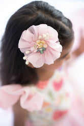 Pink organza circular hair accessory